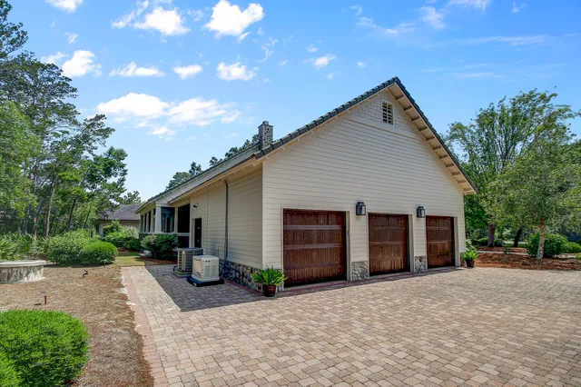 a view of a house with a yard and garage