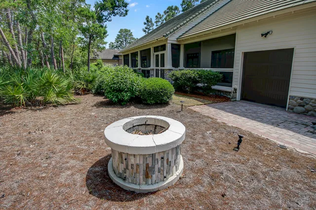 a view of a house with a backyard and a tub