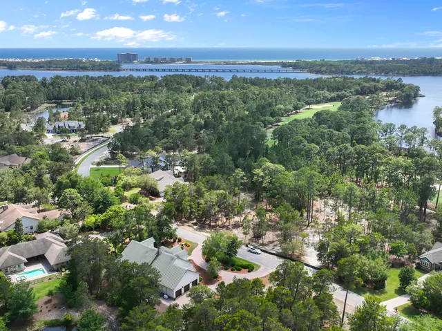 an aerial view of a city with lots of residential buildings and green space