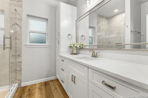 a bathroom with a sink and a mirror