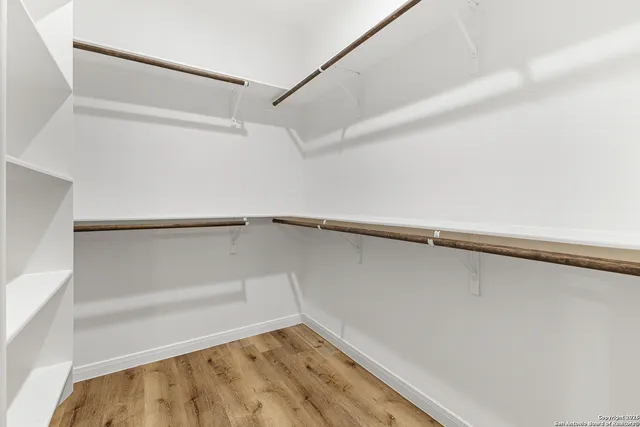 a view of an empty walk in closet