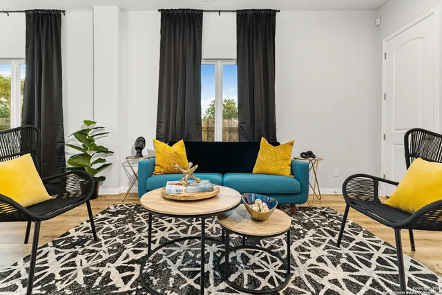 a living room with furniture and a window