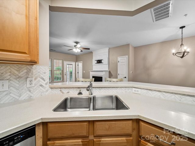 a kitchen with a sink and a window
