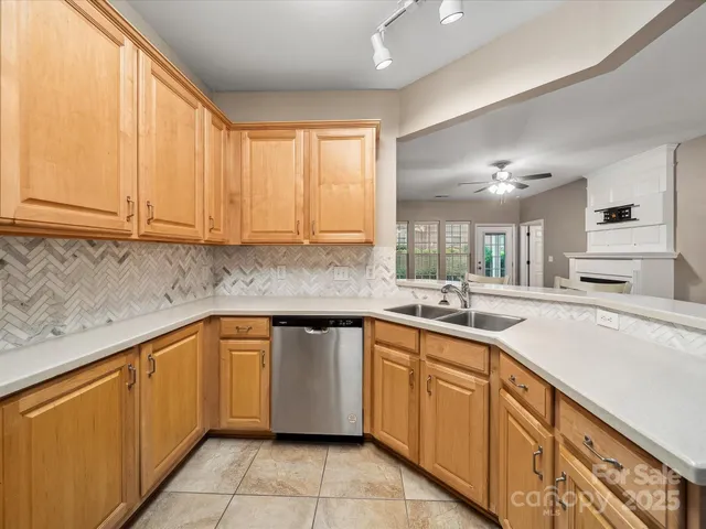 a kitchen with stainless steel appliances granite countertop a sink and cabinets