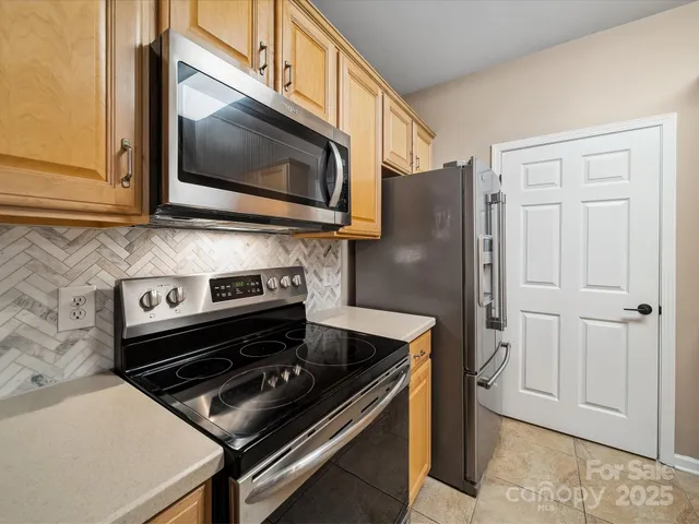 a kitchen with a stove and a microwave