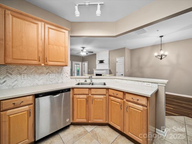 a kitchen that has a sink and cabinets