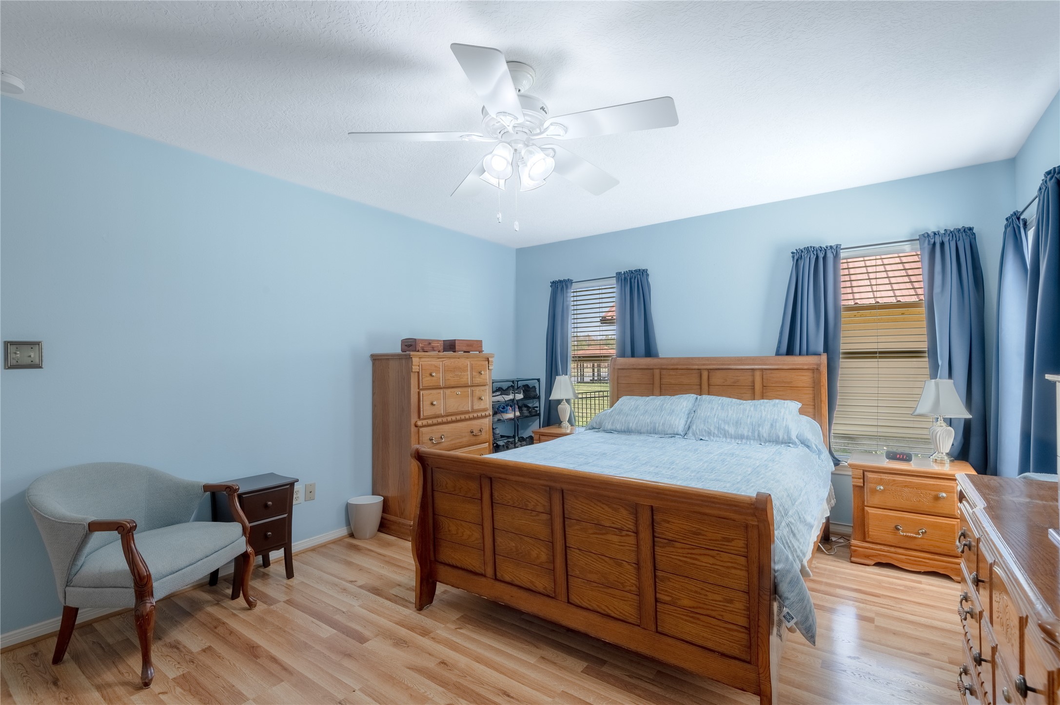 15 Lake Side Trinity, TX 75862 - Photo 17 of 33 a bedroom with a bed and wooden floor