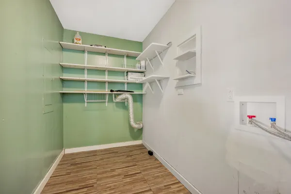 a view of a room with racks on the wall