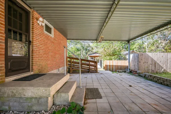 a backyard of a house with seating space