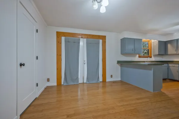 a view of kitchen with wooden floor