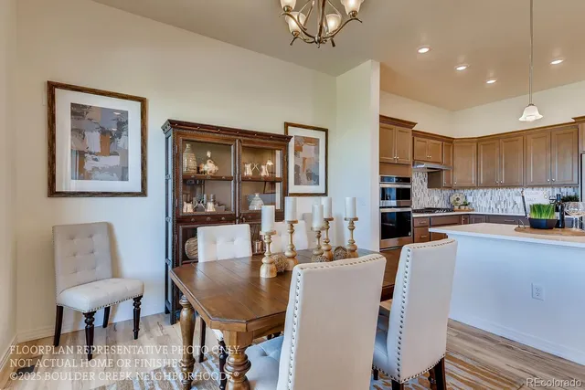 a living room with stainless steel appliances kitchen island granite countertop furniture and a kitchen view