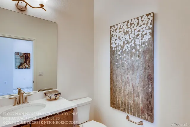 a bathroom with a sink a toilet and shower curtain
