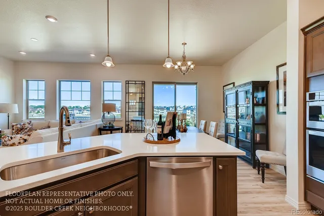 a kitchen with stainless steel appliances a sink stove and cabinets