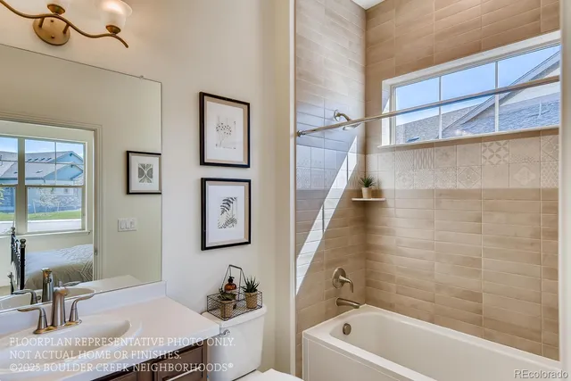 a bathroom with a sink a bathtub and a mirror