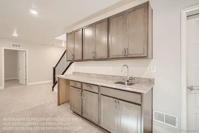 a view of a kitchen with sink and dishwasher