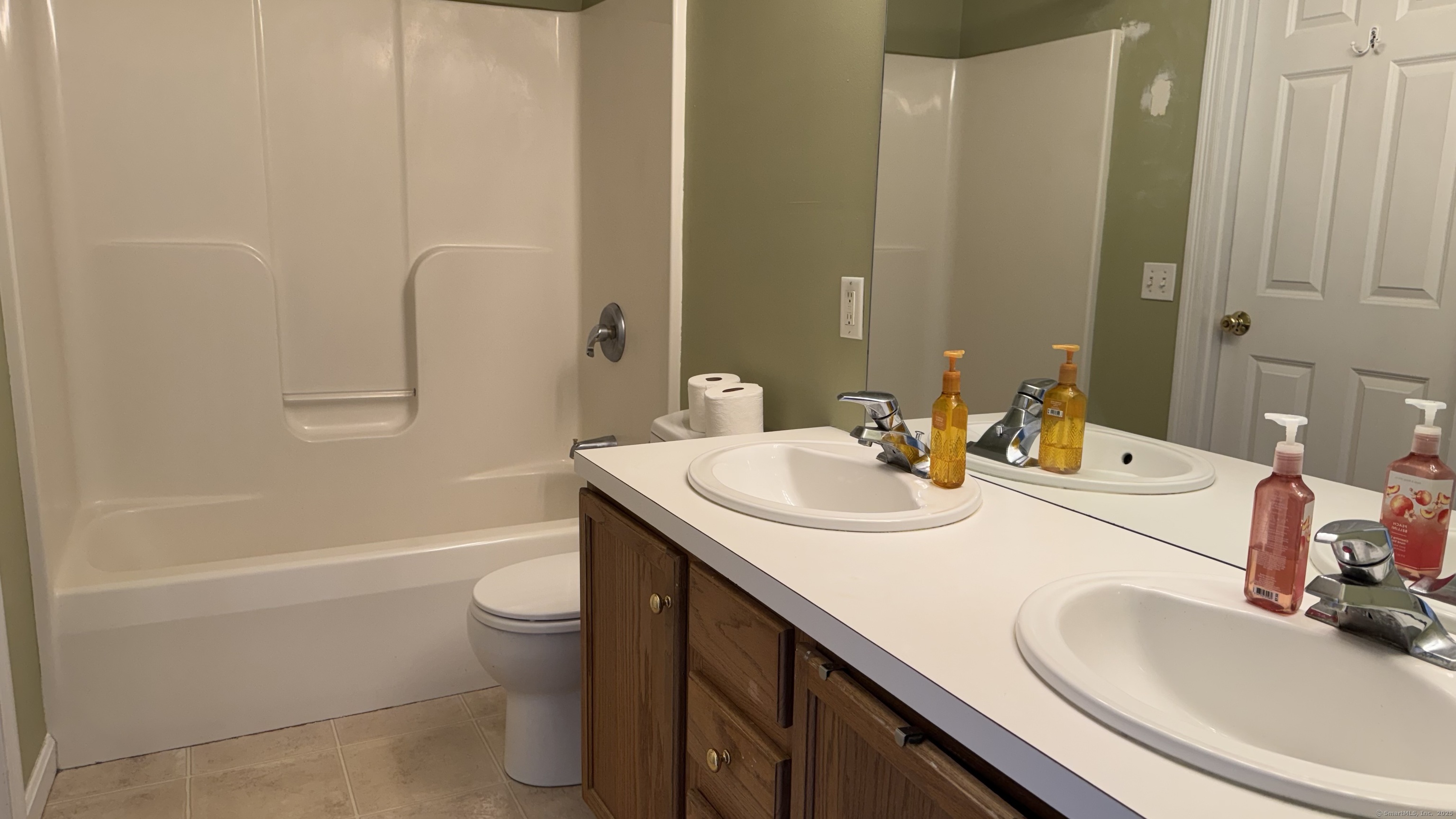 40 Mountain Laurel Way, Unit 40 Suffield, CT 06078 - Photo 8 of 16 a bathroom with a sink a toilet and shower