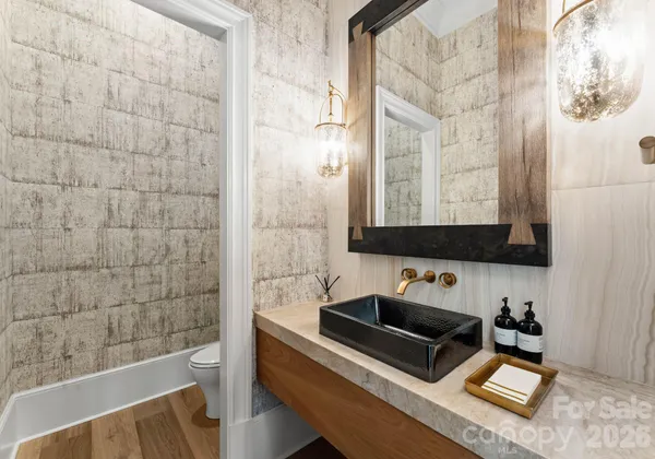 a bathroom with a sink a mirror and a bathtub