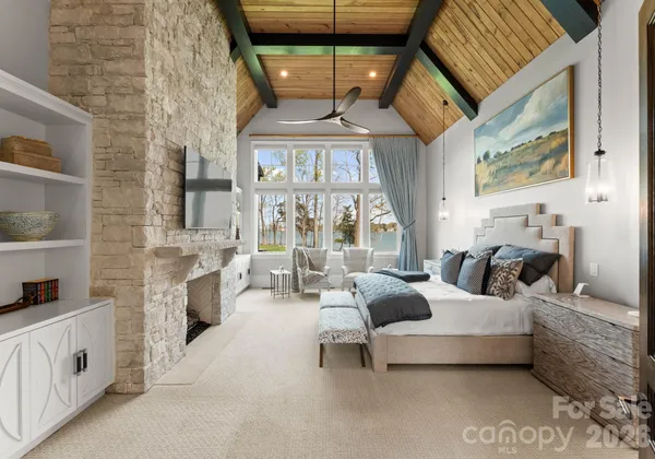 a living room with furniture fireplace and a window