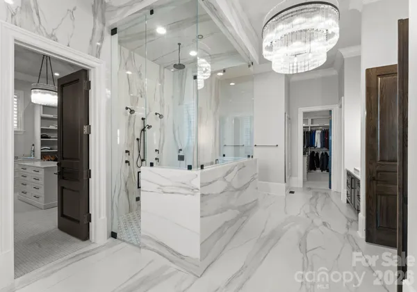 a spacious bathroom with a bathtub shower and a sink