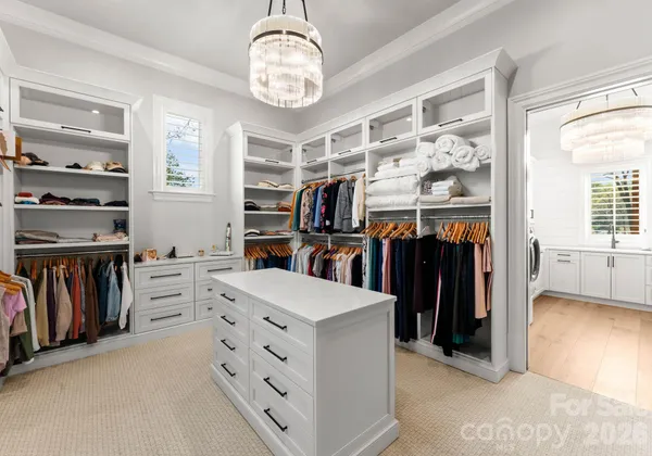 a view of a walk in closet and bedroom