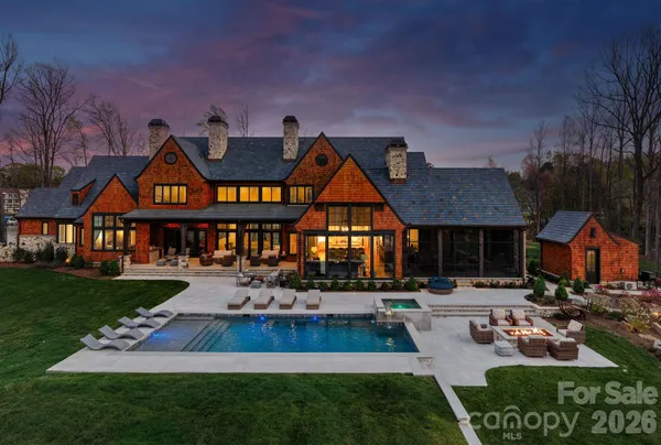 a front view of house with yard and green space