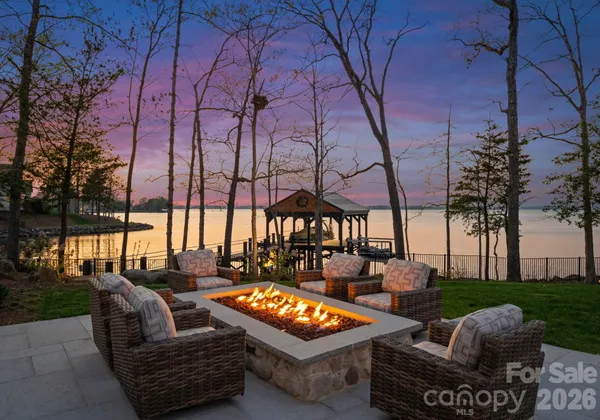 a outdoor living space with patio furniture and a fire pit