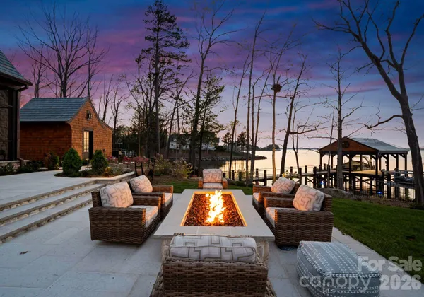 a swimming pool with outdoor seating and yard