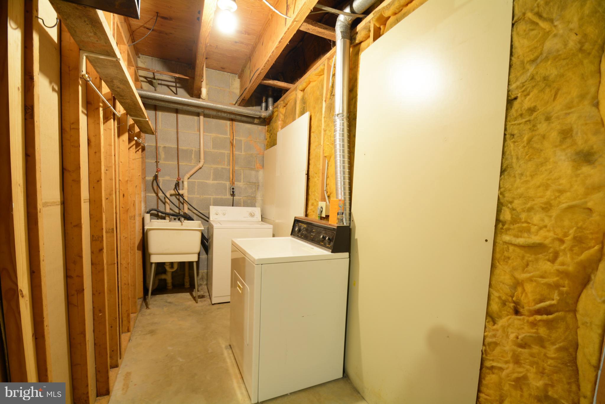 8985 Omega Court Springfield, VA 22152 - Photo 15 of 25 Basement Laundry Area with Deep Sink