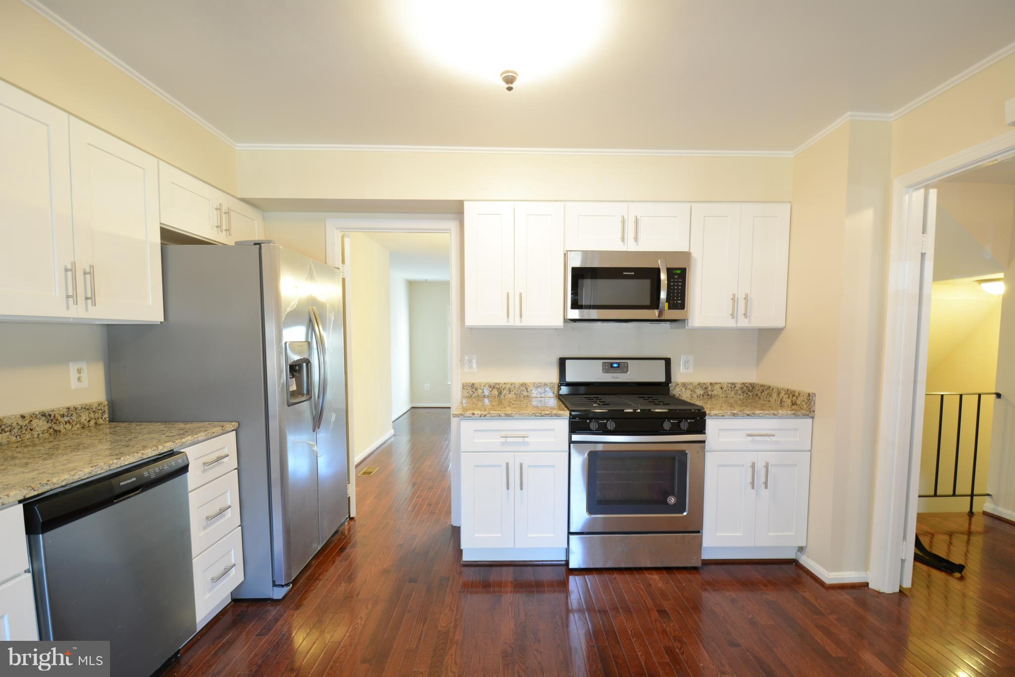 8985 Omega Court Springfield, VA 22152 - Photo 6 of 25 Custom Kitchen with Access to Hall and Dinning Ar