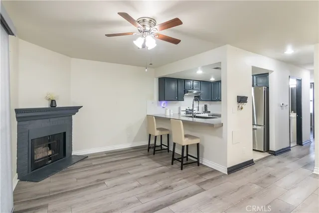 a view of a tennis court with view of buildings in the background