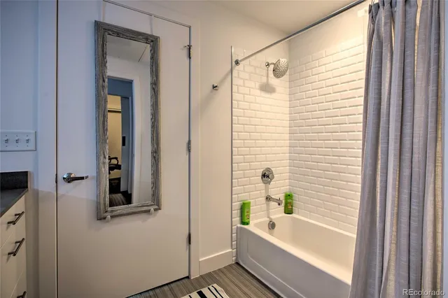 a bathroom with a bathtub and a shower