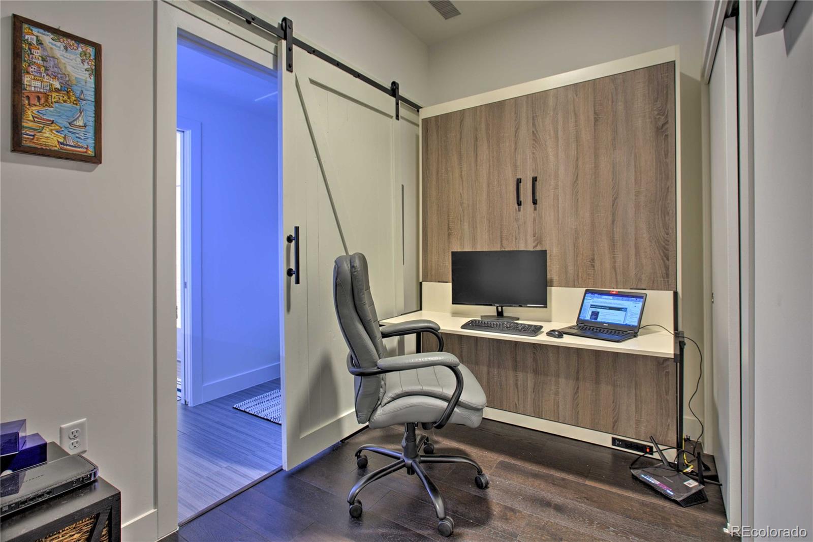 2550 Lawrence Street, Unit RB204 Denver, CO 80205 - Photo 24 of 36 a view of a workspace with furniture and stairs