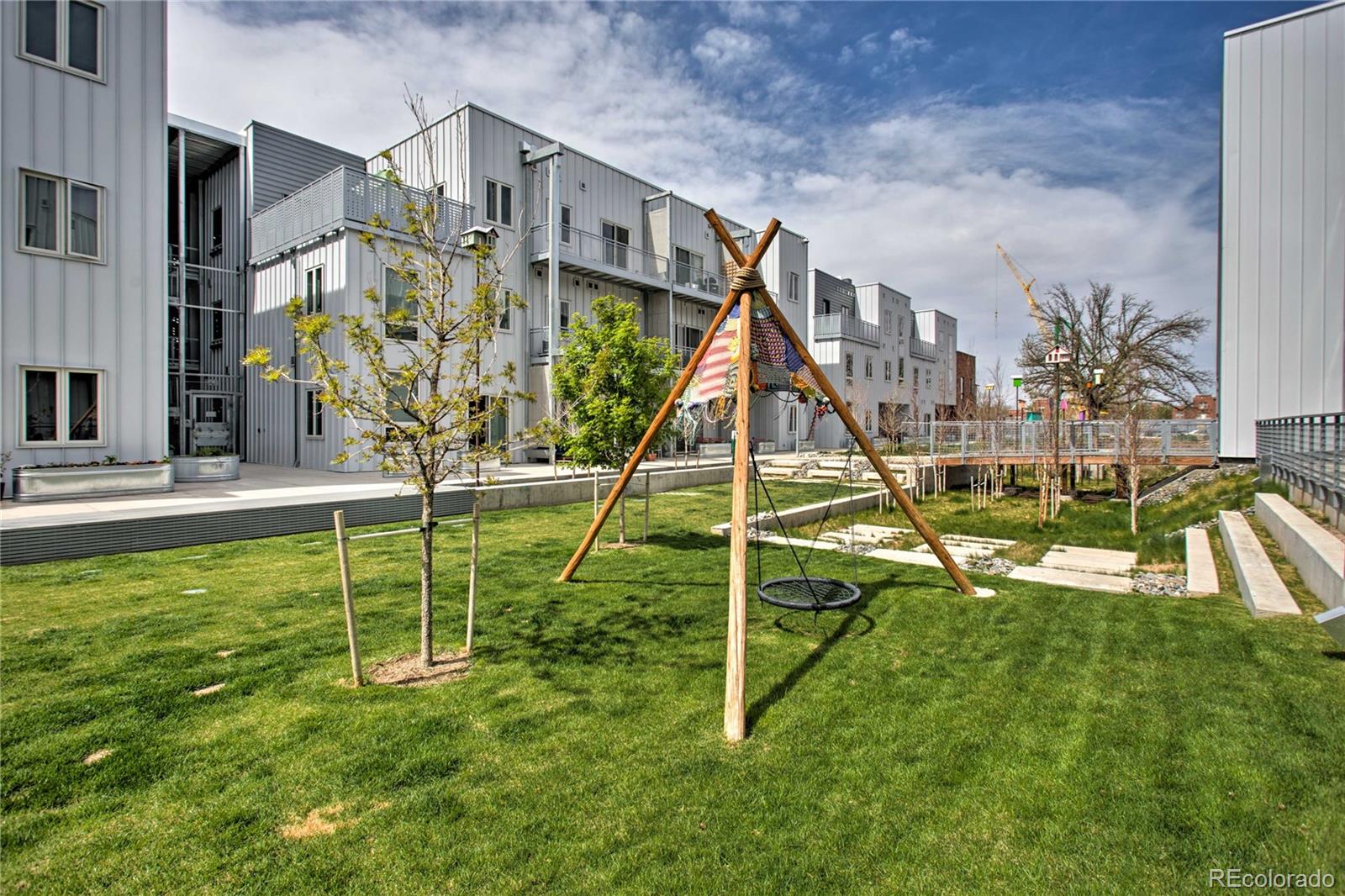 2550 Lawrence Street, Unit RB204 Denver, CO 80205 - Photo 32 of 36 a view of a house with a park