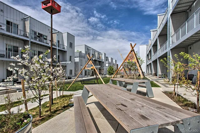 a view of a building with a yard