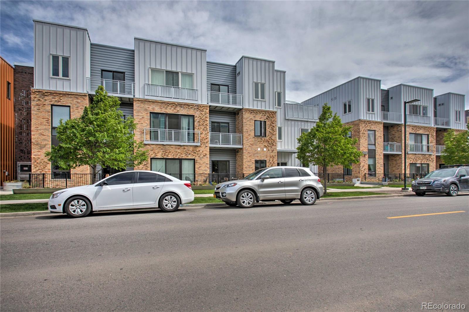 2550 Lawrence Street, Unit RB204 Denver, CO 80205 - Photo 36 of 36 a view of a cars parked in front of a building