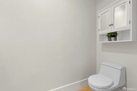 a bathroom with a glass shower door