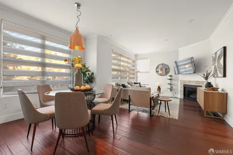 a view of a dining room with furniture window and wooden floor