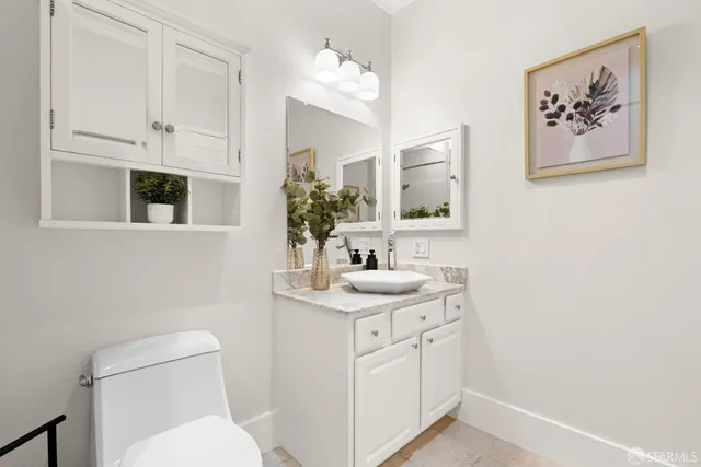 a bathroom with a toilet and a tub