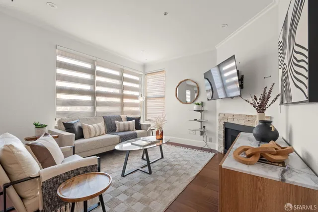 a bedroom with a bed and a potted plant