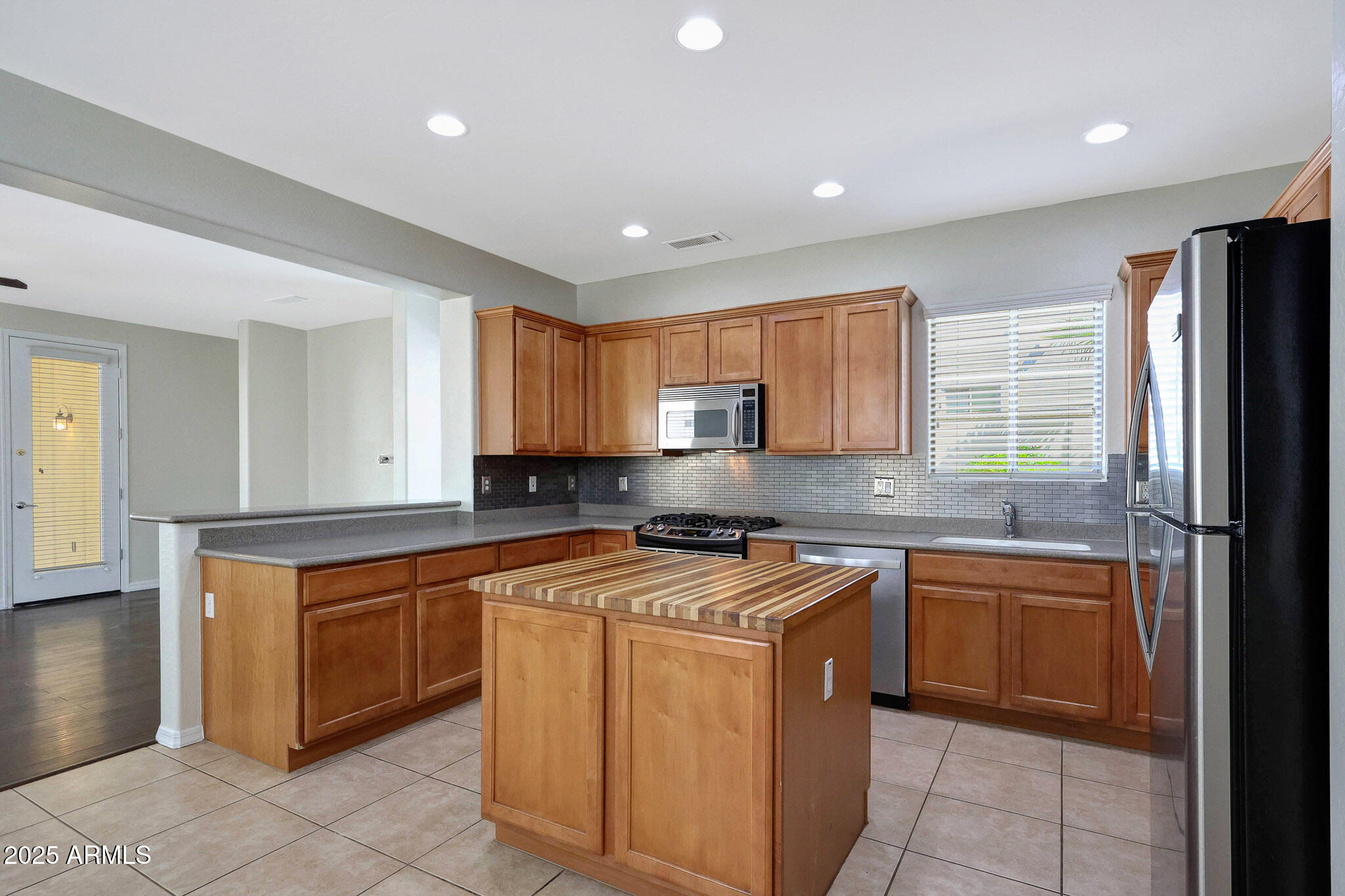 20822 West Ridge Road Buckeye, AZ 85396 - Photo 11 of 46 a kitchen with a sink stove and cabinets