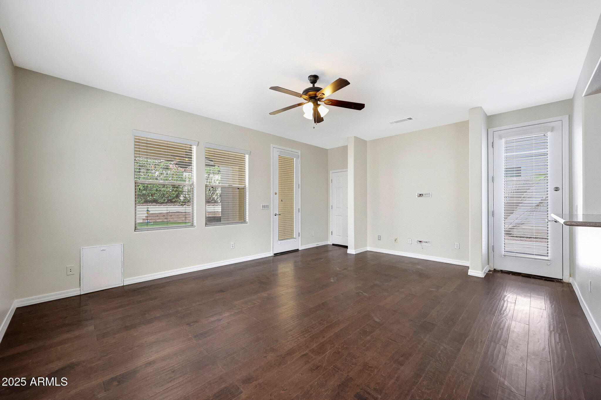 20822 West Ridge Road Buckeye, AZ 85396 - Photo 20 of 46 a view of empty room with wooden floor and fan