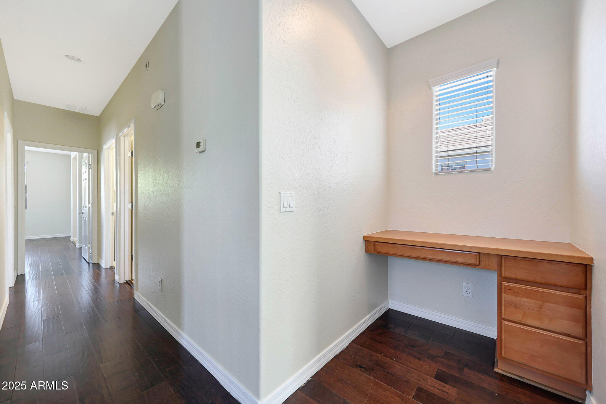 20822 West Ridge Road Buckeye, AZ 85396 - Photo 22 of 46 a hallway with a wooden floor and a closet