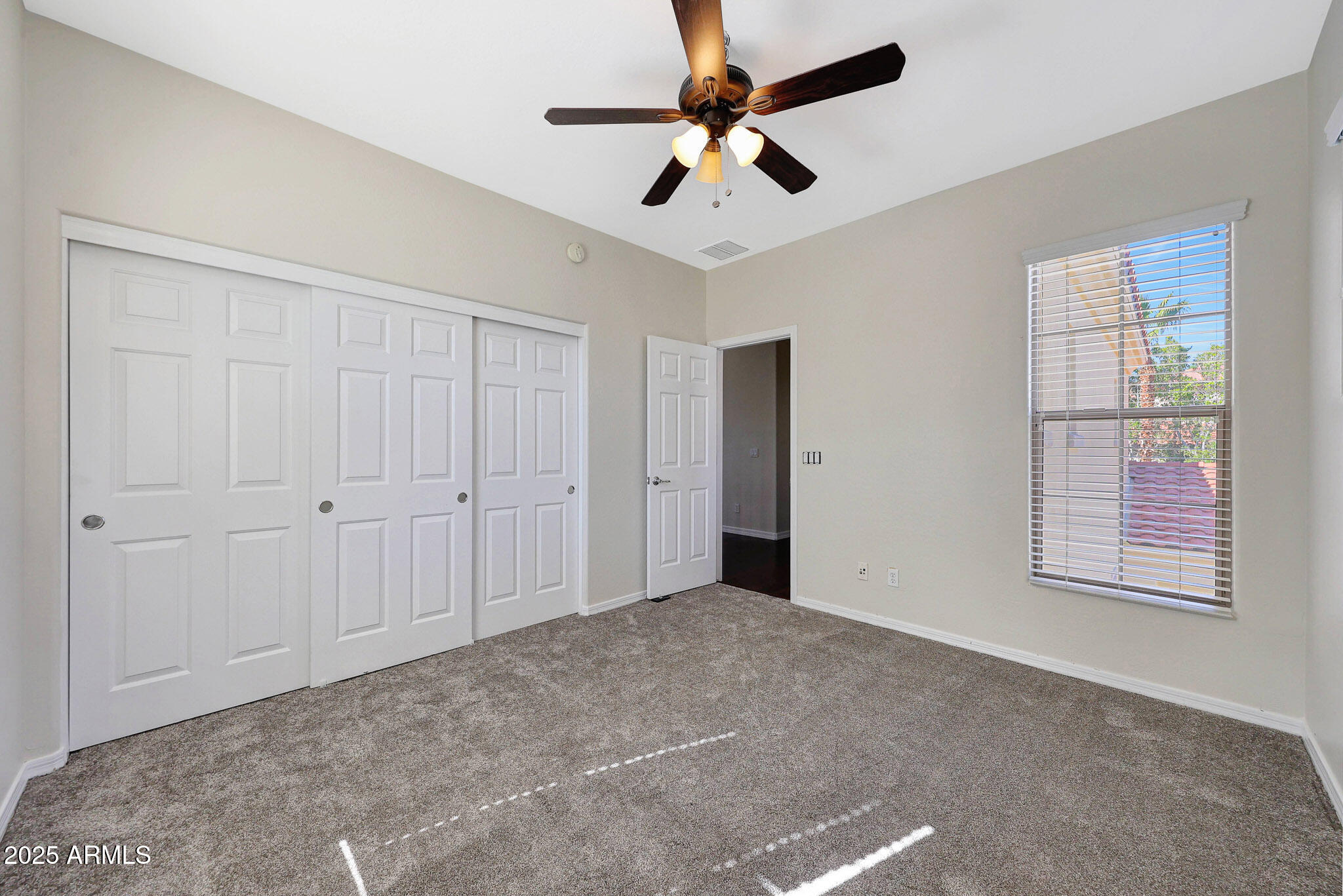 20822 West Ridge Road Buckeye, AZ 85396 - Photo 28 of 46 a view of an empty room with a window