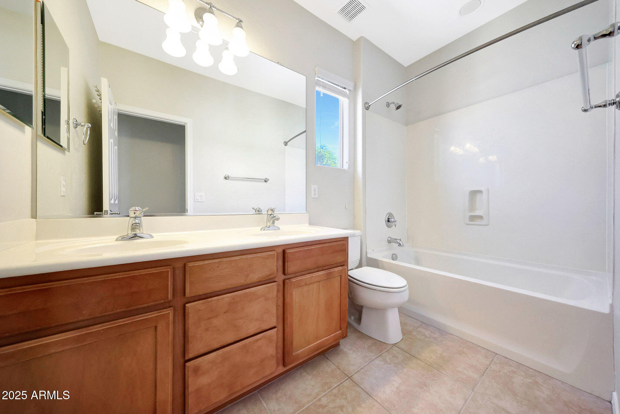 20822 West Ridge Road Buckeye, AZ 85396 - Photo 30 of 46 a bathroom with a double vanity sink toilet and a mirror