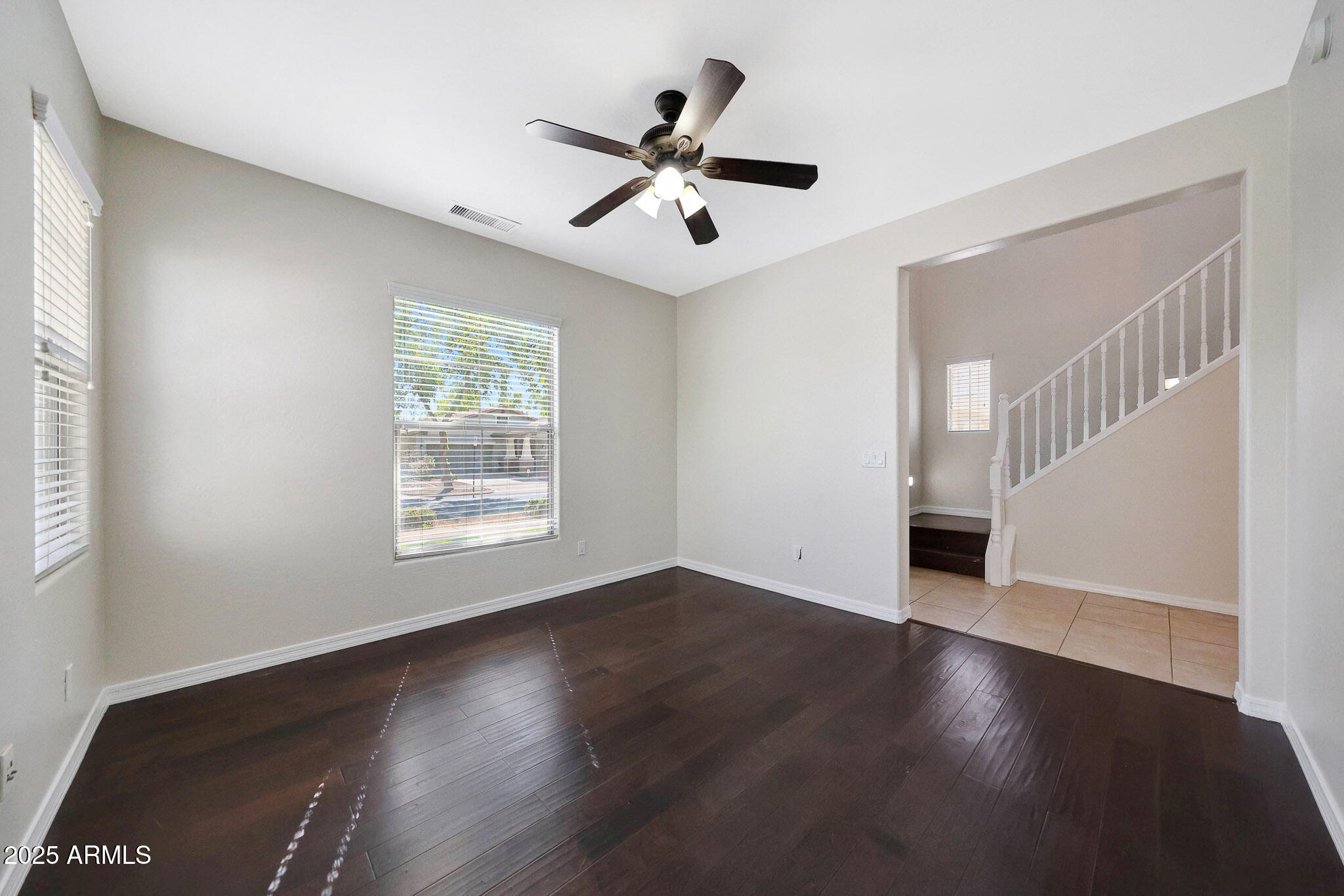 20822 West Ridge Road Buckeye, AZ 85396 - Photo 9 of 46 a view of an empty room with wooden floor and a window