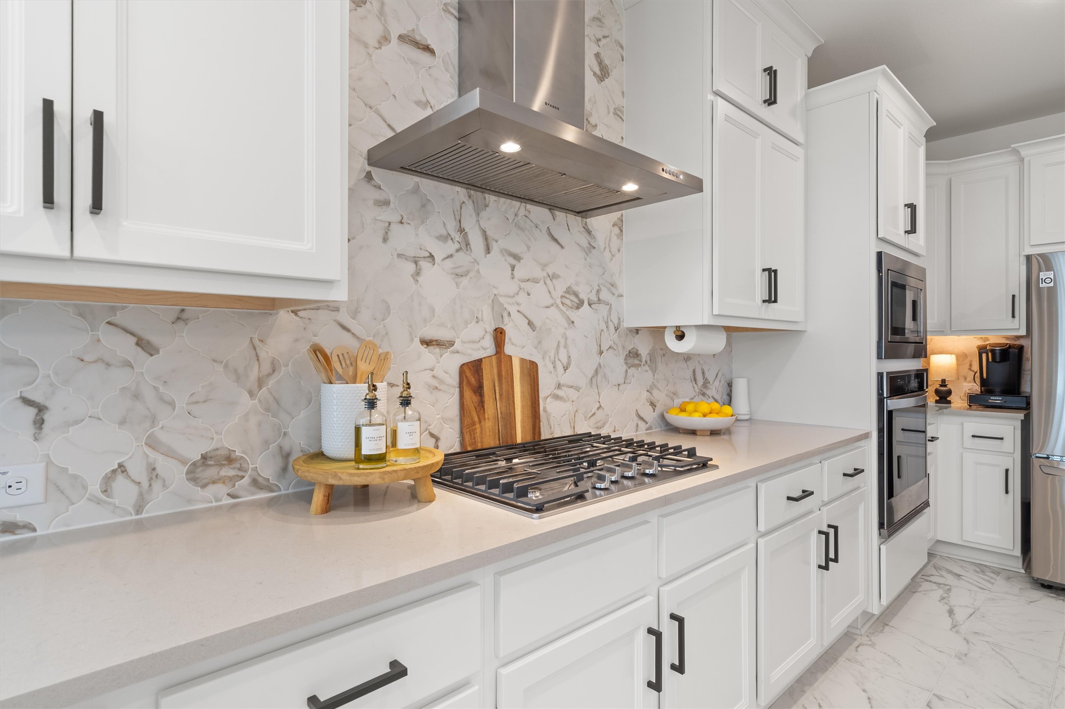 209 Rio Ranchero Road Georgetown, TX 78628 - Photo 3 of 37 Gas cooktop and gorgeous backsplash!