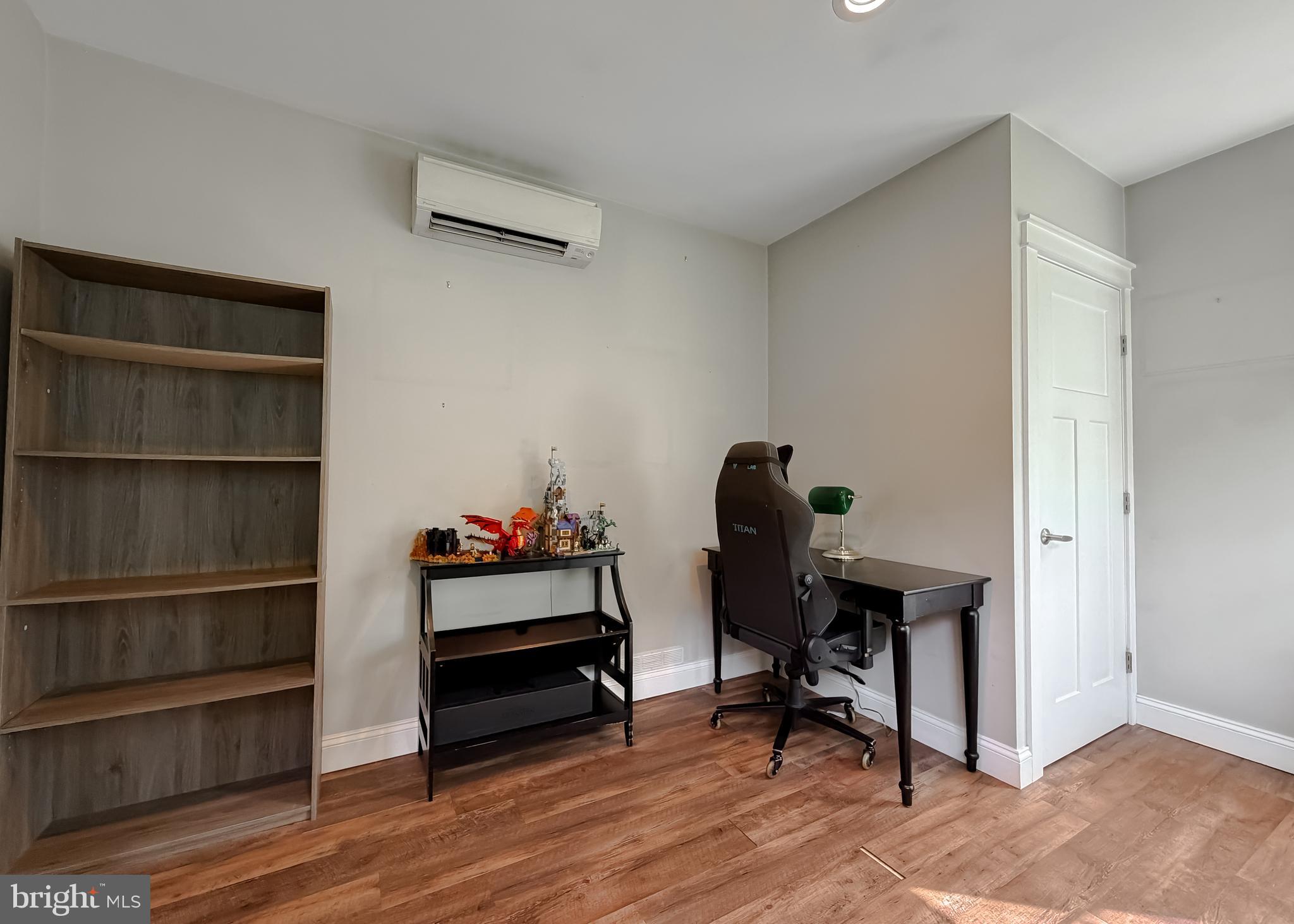 16146 Thomas Road Piney Point, MD 20674 - Photo 9 of 57 a view of a workspace with furniture and wooden floor