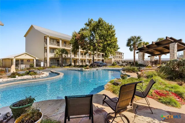a view of a backyard with sitting area