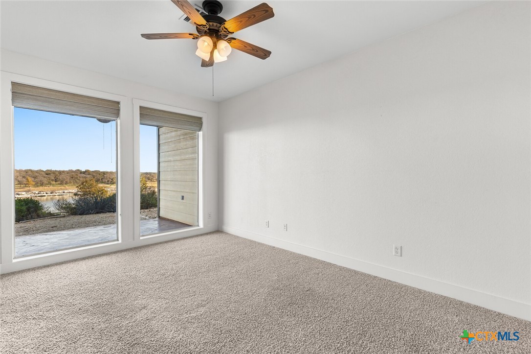 130 Sobrante Road, Unit 112 Belton, TX 76513 - Photo 18 of 48 a view of a room with a ceiling fan and window