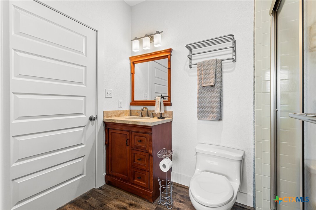 130 Sobrante Road, Unit 112 Belton, TX 76513 - Photo 26 of 48 a bathroom with a toilet a sink and a mirror
